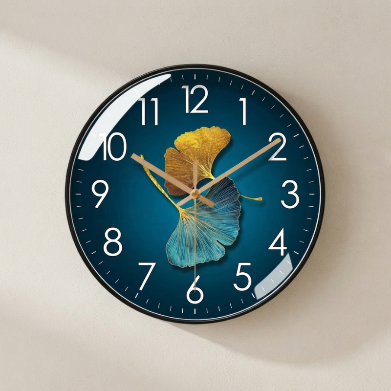 Wall clock with blue and yellow leaf design on a beige wall