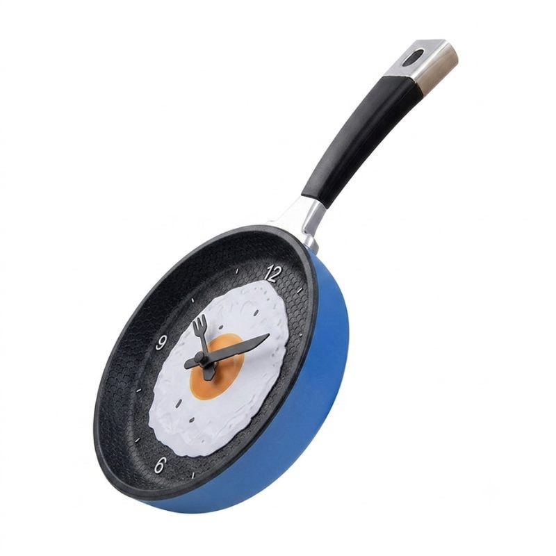 Frying pan clock with a design of an egg on a white background