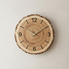 Wooden clock with tree ring design on a plain background