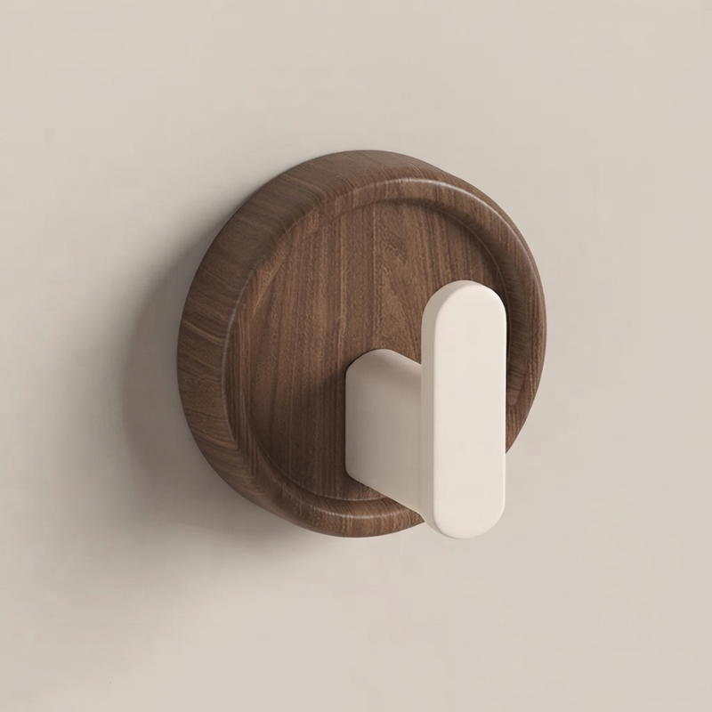 Wooden wall hook with a white handle on a beige background