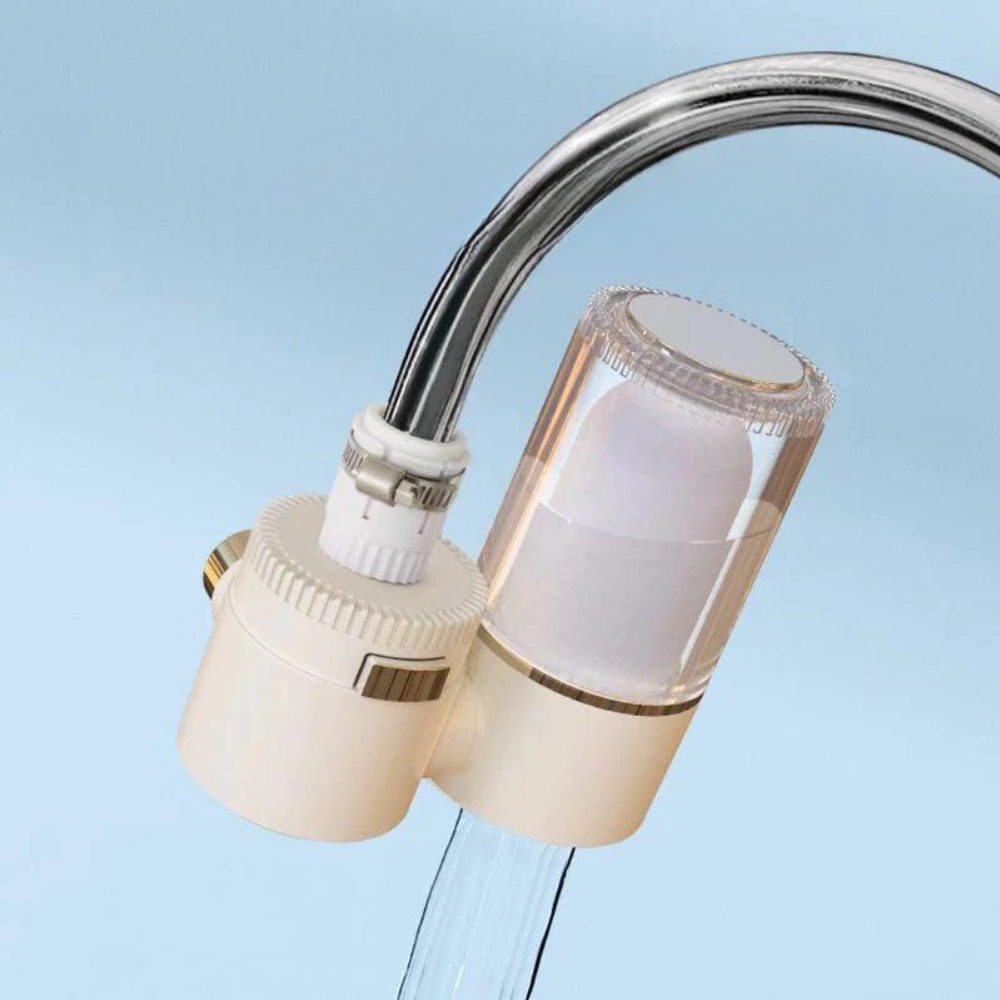 Close-up of a faucet with a water filter attachment on a light blue background