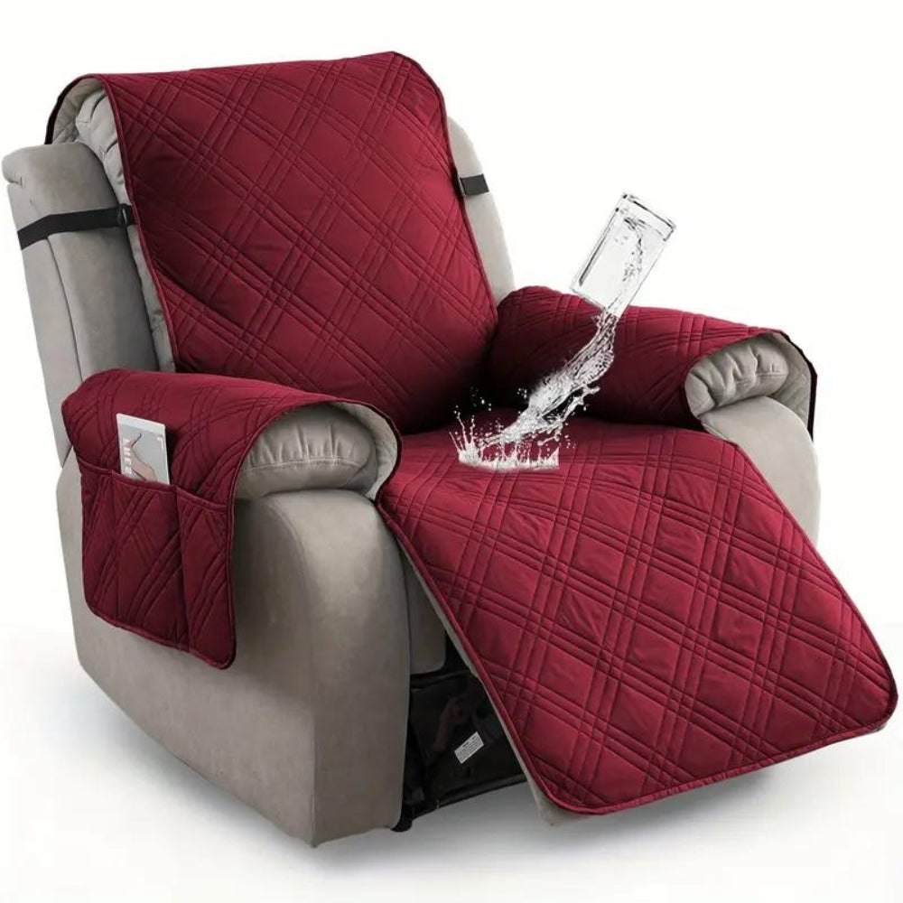 Red quilted chair cover protecting a gray recliner from water spillage.