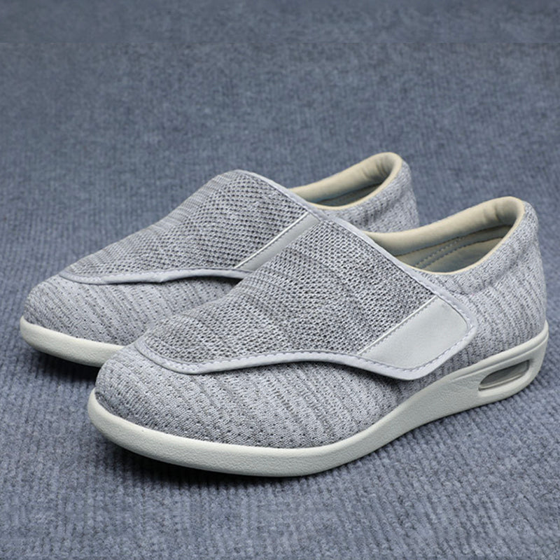 Pair of gray slip-on shoes on a gray background