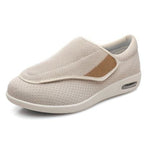 Beige slip-on shoe with a patch on a white background