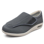 Gray slip-on shoe with white sole on a white background