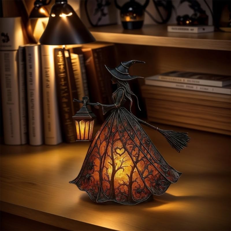 Decorative witch lamp with a warm glow on a wooden surface with books in the background.