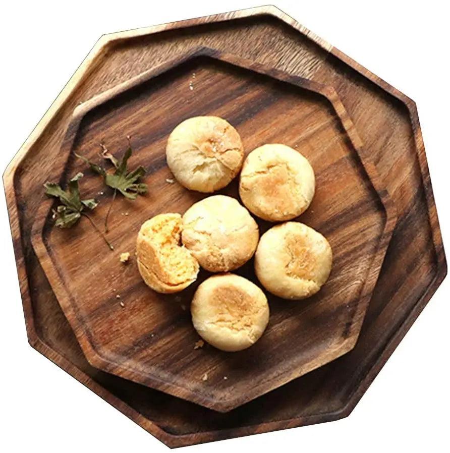 Wooden tray with round cookies on a white background