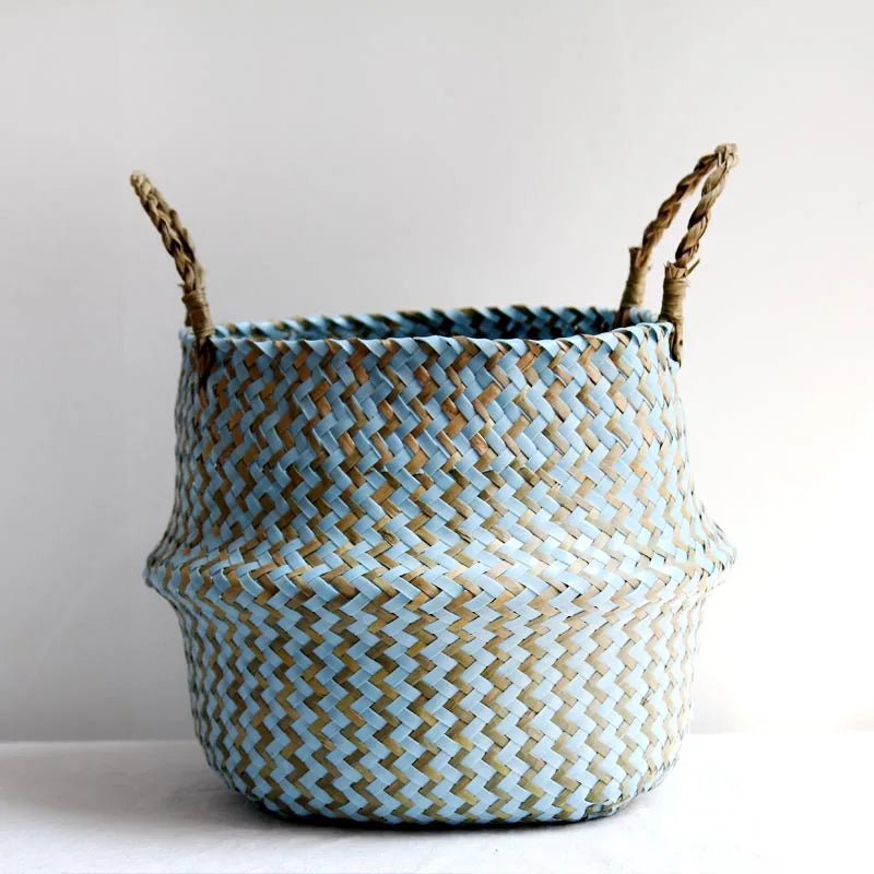 Woven basket with blue and natural pattern on a white background