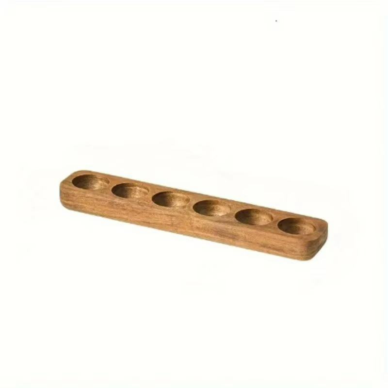 Wooden holder with five circular槽s on a white background