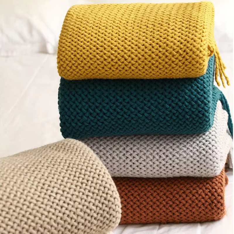 Stack of colorful knitted blankets