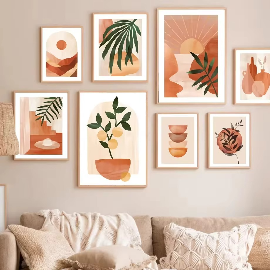 Wall art prints with nature-themed designs in a living room setting.