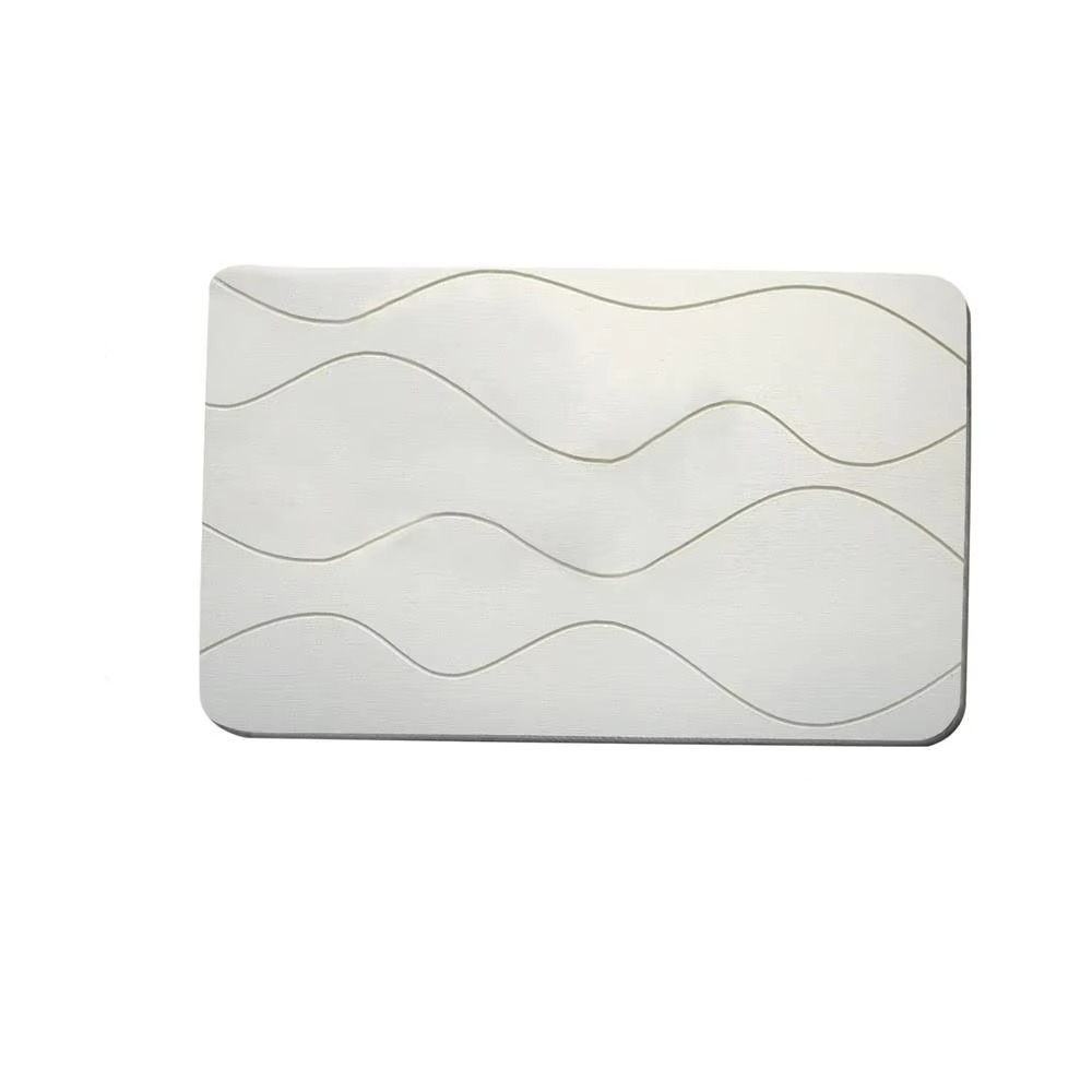 White bath mat with wavy pattern and measurements on a white background