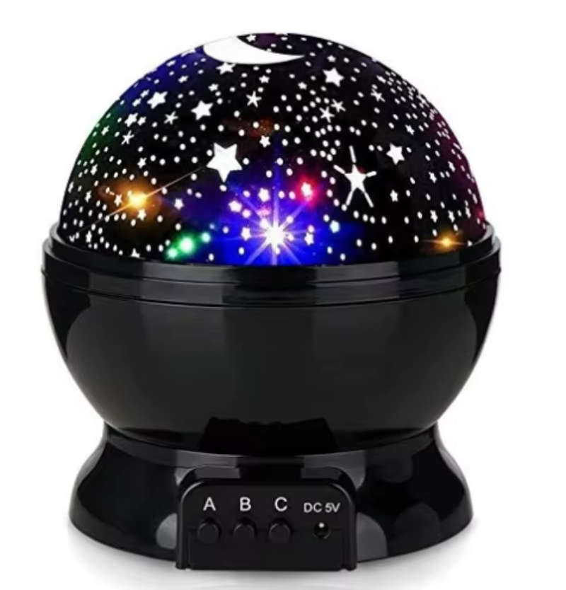 Colorful starry night light projector on a white background