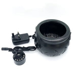 Black decorative pot with a power adapter on a white background
