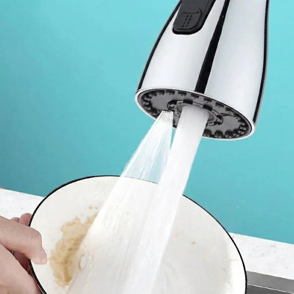 Sprayer head with water flowing into a bowl against a blue background