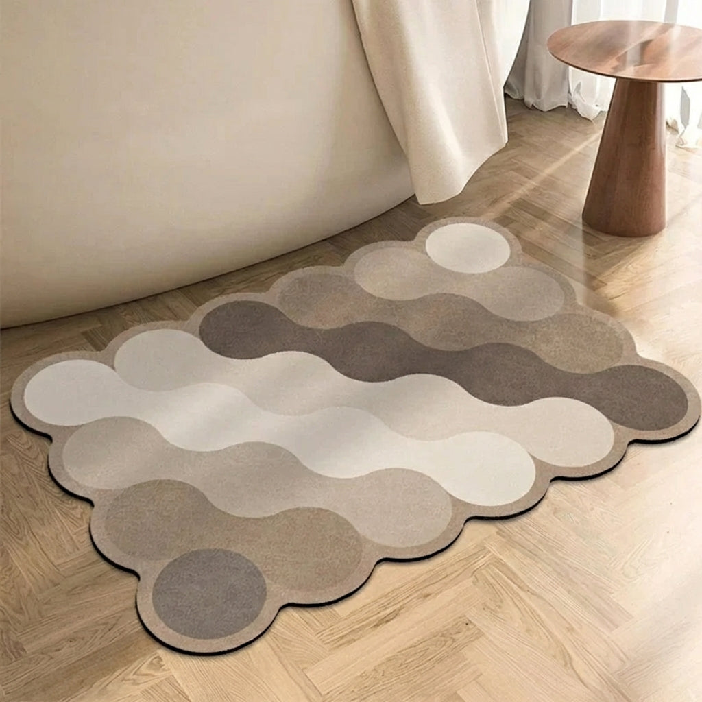 Wavy patterned rug on a wooden floor with a neutral color scheme