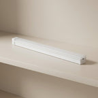 White LED strip light on a beige surface