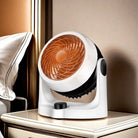 White and black fan on a surface with a neutral background