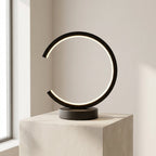 Modern table lamp with circular design on a neutral background