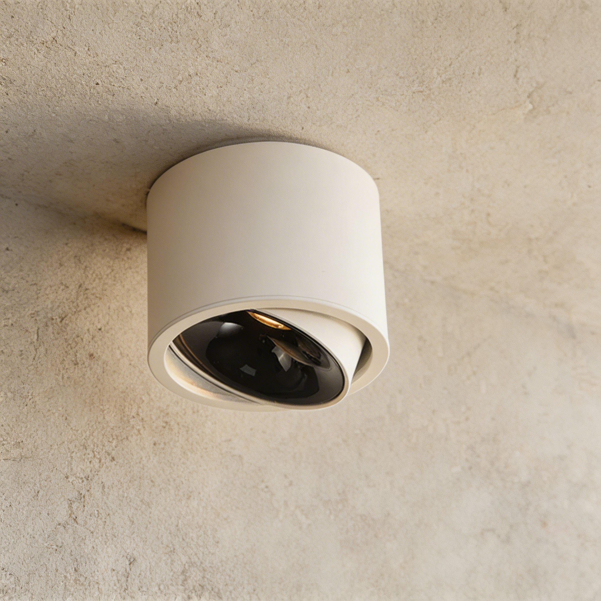 Ceiling light fixture on a textured beige wall