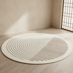 Round beige rug with concentric circle pattern on a wooden floor.