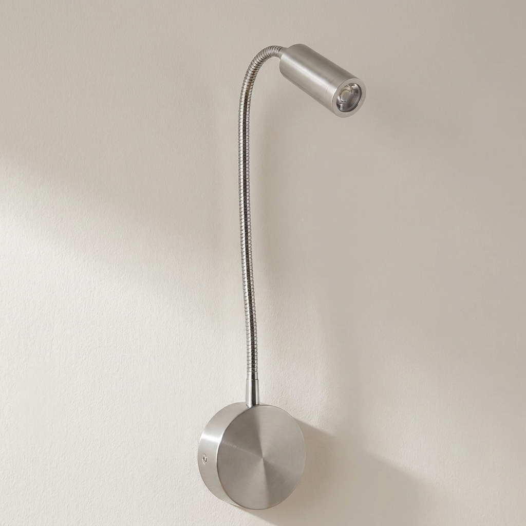 Silver wall-mounted lamp with flexible neck on a beige background