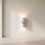 Modern wall-mounted light fixture on a neutral wall