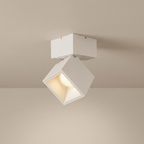 White square ceiling light fixture on a beige ceiling