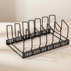 Black metal bottle rack on a beige surface