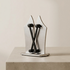 Metallic bookend with a modern design on a neutral background