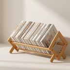 Wooden book stand with books on a plain background