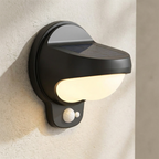 Solar-powered outdoor wall light fixture on a textured wall.