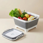 Collapsible fruit and vegetable bin with fresh produce on a beige surface