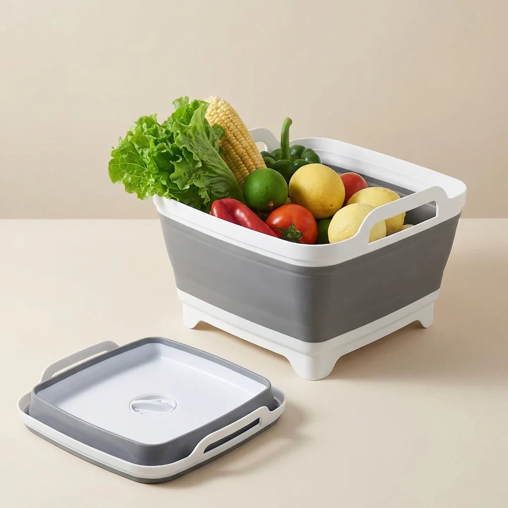 Collapsible fruit and vegetable bin with fresh produce on a beige surface