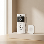 White security camera with a speaker on a beige shelf against a beige wall