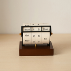 Perpetual calendar on a wooden base with a beige background