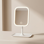 Rectangular vanity mirror with LED lighting on a beige background