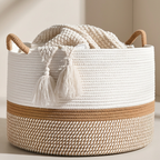 Woven basket with white textured fabric and tassels on a neutral background
