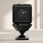 Black security camera on a beige background