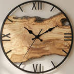 Wooden wall clock with natural finish and black Roman numerals on a light background