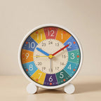 Colorful clock with a white frame on a beige background
