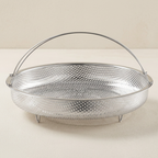 Metal mesh tray with handle on a light beige background