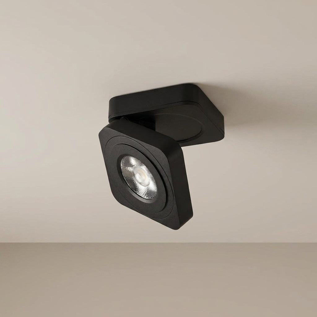 Black square ceiling light fixture on a beige background