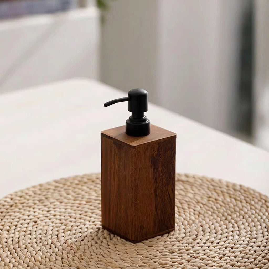 Wooden soap dispenser with black pump on a woven mat
