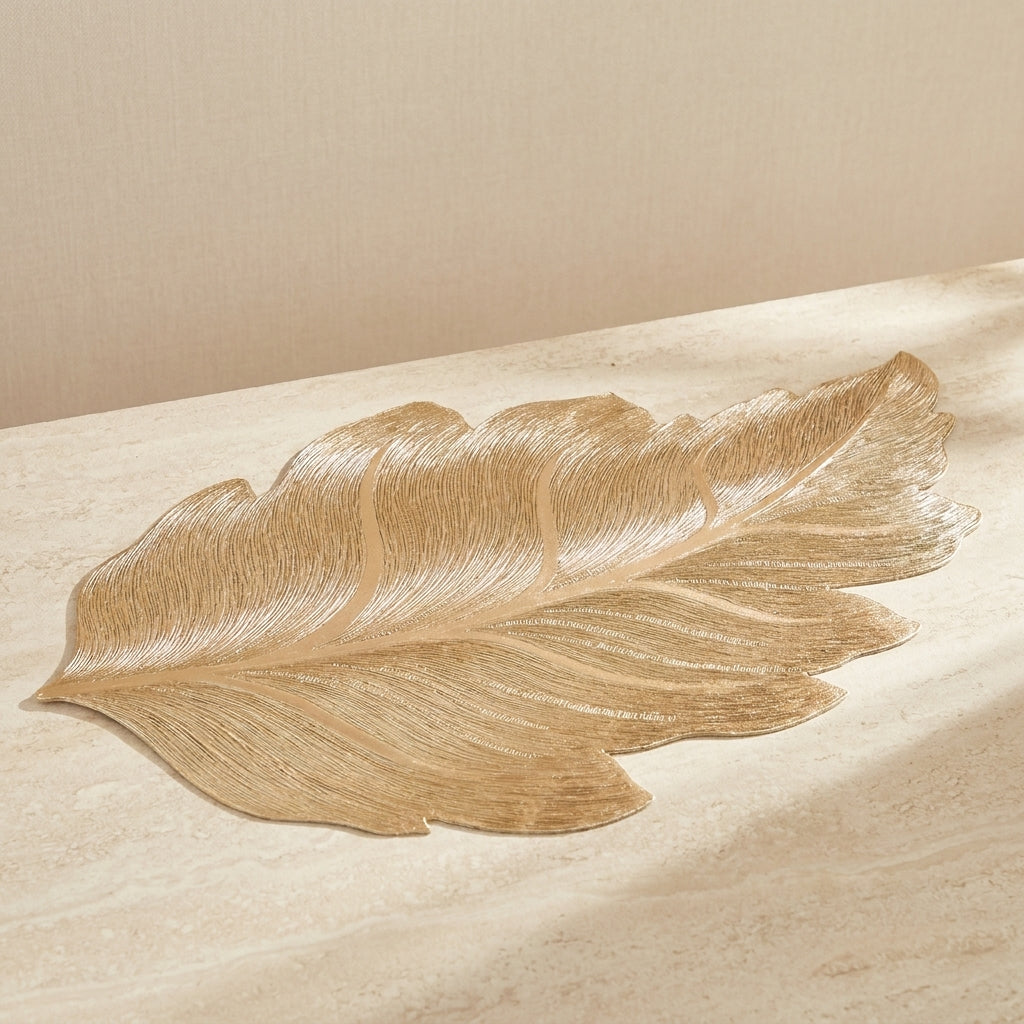 Gold leaf on a beige surface