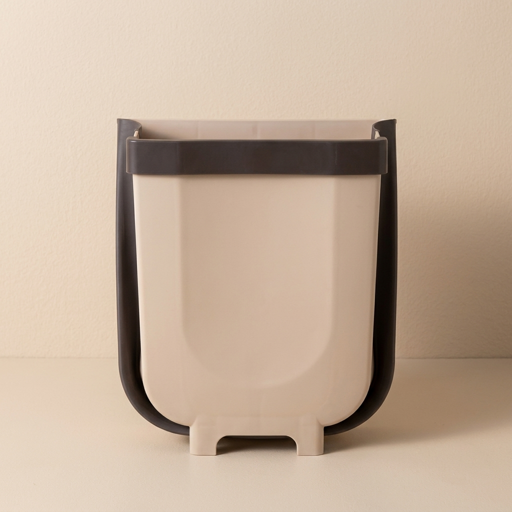 Beige trash can with black metal frame on a beige background