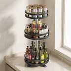 Three-tiered spice rack with various bottles on a kitchen counter.