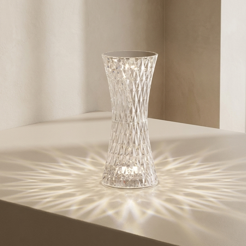 Clear glass vase on a light surface with soft shadows