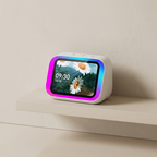 Digital clock with a screen displaying flowers on a white surface