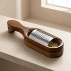 Wooden grater with metal surface on a light-colored surface